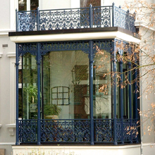 Oriel made of glass with wooden decoration